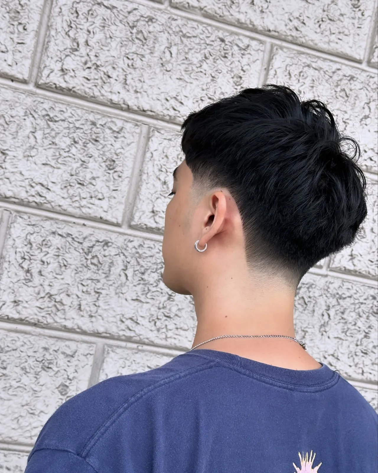 Precision tapered haircut photographed from the back