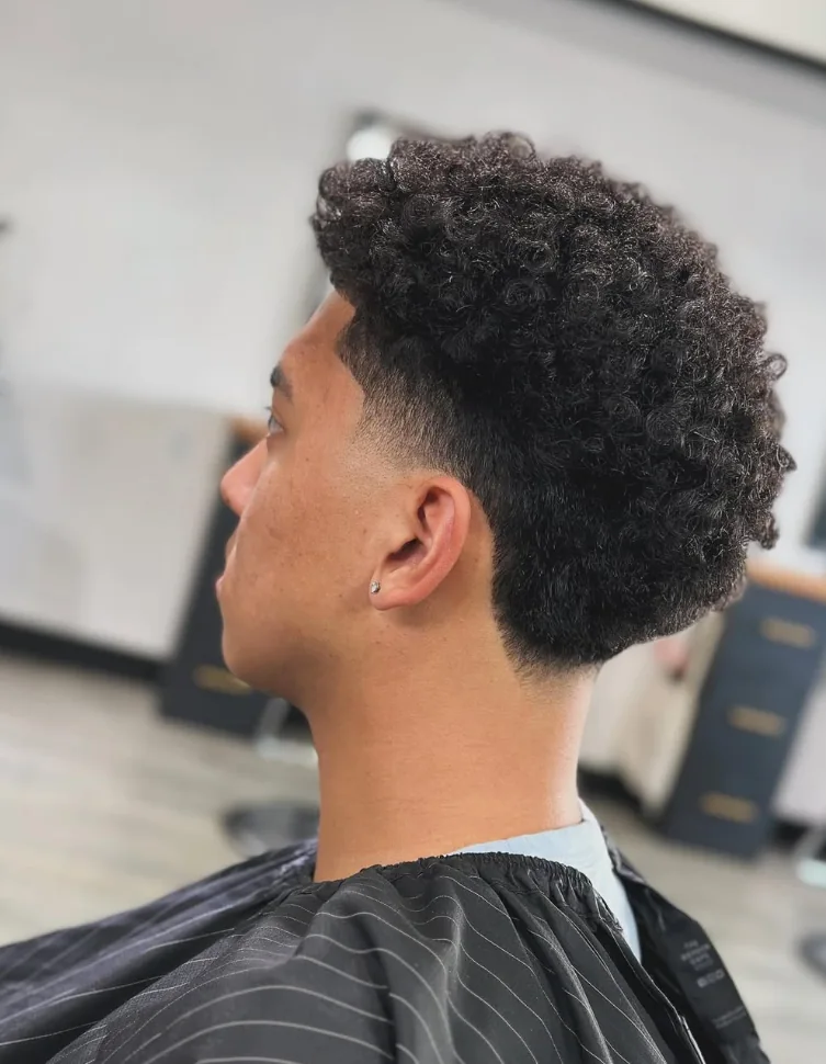 Curly haircut with a clean taper